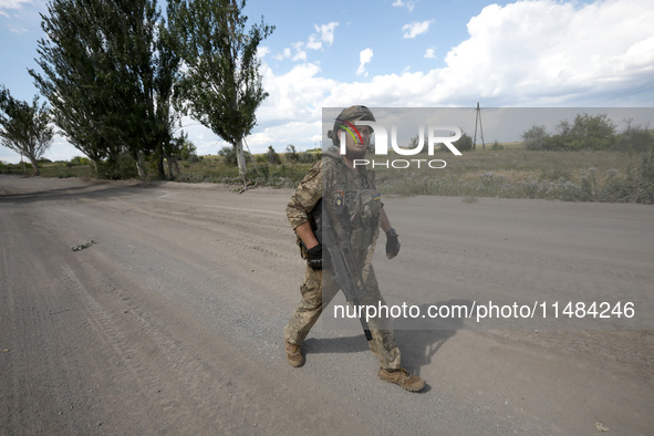 A serviceman of the Motorised Rifle Battalion of the 93rd Kholodnyi Yar Separate Mechanized Brigade of the Ukrainian Armed Forces is walking...