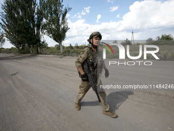 A serviceman of the Motorised Rifle Battalion of the 93rd Kholodnyi Yar Separate Mechanized Brigade of the Ukrainian Armed Forces is walking...