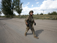 A serviceman of the Motorised Rifle Battalion of the 93rd Kholodnyi Yar Separate Mechanized Brigade of the Ukrainian Armed Forces is walking...