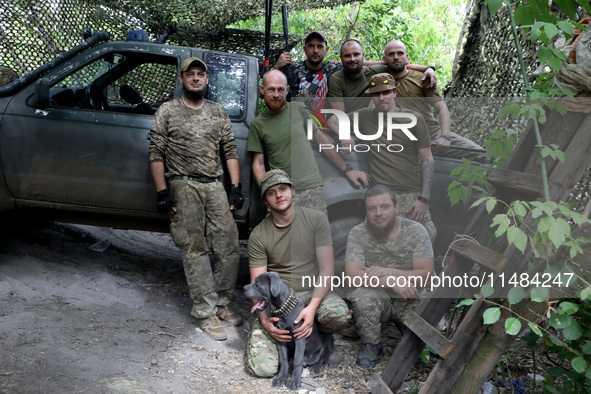 Servicemen of the Motorised Rifle Battalion of the 93rd Kholodnyi Yar Separate Mechanized Brigade of the Ukrainian Armed Forces are posing f...