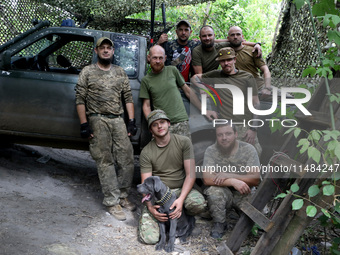 Servicemen of the Motorised Rifle Battalion of the 93rd Kholodnyi Yar Separate Mechanized Brigade of the Ukrainian Armed Forces are posing f...