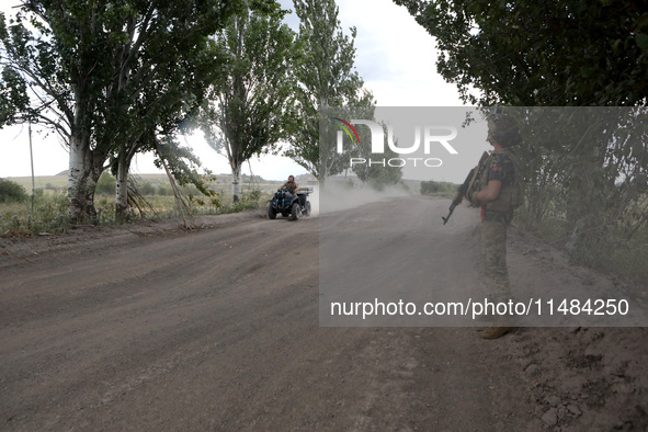 A serviceman of the Motorised Rifle Battalion of the 93rd Kholodnyi Yar Separate Mechanized Brigade of the Ukrainian Armed Forces is riding...