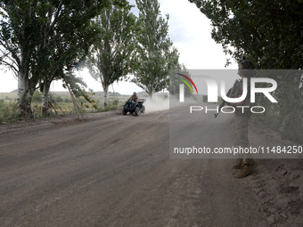 A serviceman of the Motorised Rifle Battalion of the 93rd Kholodnyi Yar Separate Mechanized Brigade of the Ukrainian Armed Forces is riding...