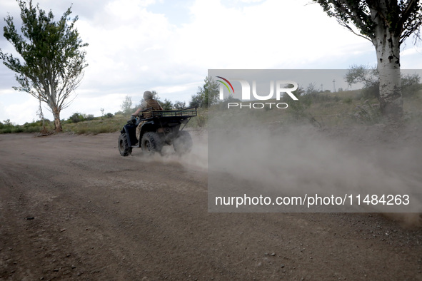 A serviceman of the Motorised Rifle Battalion of the 93rd Kholodnyi Yar Separate Mechanized Brigade of the Ukrainian Armed Forces is riding...