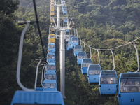 Tourists are riding ropeways at Lianhua Mountain in Dalian, China, on August 15, 2024. (