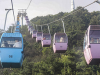 Tourists are riding ropeways at Lianhua Mountain in Dalian, China, on August 15, 2024. (