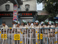 Police are seen during a protest demonstration against the brutal rape and murder of a doctor at RG Kar Medical College and Hospital, in Kol...