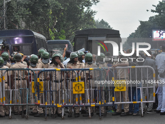 Police are seen during a protest demonstration against the brutal rape and murder of a doctor at RG Kar Medical College and Hospital, in Kol...