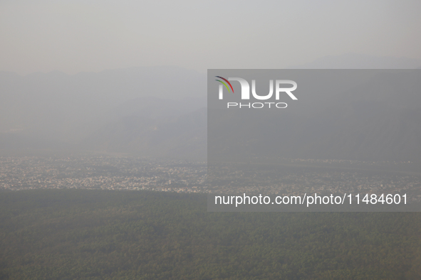 Smog is covering the town of Dehradun in Uttarakhand, India, on April 17, 2024, due to nearby active forest fires. 