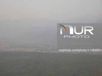 Smog is covering the town of Dehradun in Uttarakhand, India, on April 17, 2024, due to nearby active forest fires. (