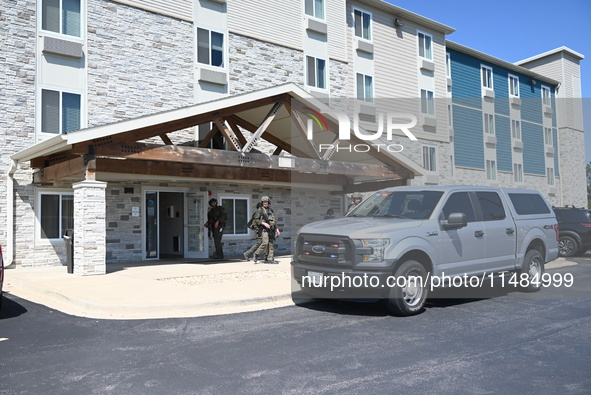 The SWAT team is raiding the WoodSpring Suites hotel in Carol Stream, Illinois, United States, on August 16, 2024. No information is immedia...