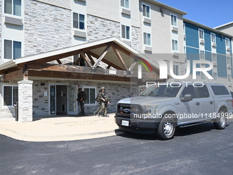 The SWAT team is raiding the WoodSpring Suites hotel in Carol Stream, Illinois, United States, on August 16, 2024. No information is immedia...