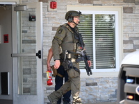 The SWAT team is raiding the WoodSpring Suites hotel in Carol Stream, Illinois, United States, on August 16, 2024. No information is immedia...