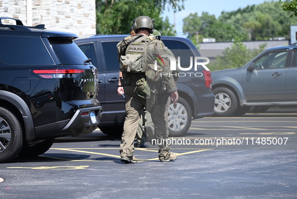 The SWAT team is raiding the WoodSpring Suites hotel in Carol Stream, Illinois, United States, on August 16, 2024. No information is immedia...