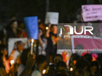 Bangladeshi women protesters are holding candlelight during the protest against rape in Dhaka, Bangladesh, on August 17, 2024. Women are mar...