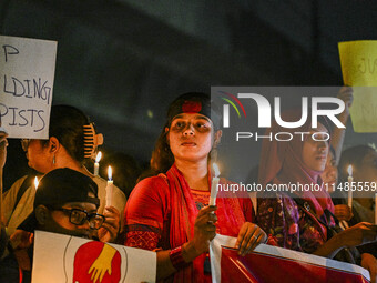 Bangladeshi women protesters are holding candlelight during the protest against rape in Dhaka, Bangladesh, on August 17, 2024. Women are mar...