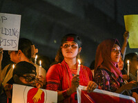 Bangladeshi women protesters are holding candlelight during the protest against rape in Dhaka, Bangladesh, on August 17, 2024. Women are mar...