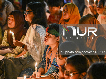 Bangladeshi women protesters are holding candlelight during the protest against rape in Dhaka, Bangladesh, on August 17, 2024. Women are mar...