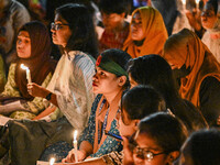 Bangladeshi women protesters are holding candlelight during the protest against rape in Dhaka, Bangladesh, on August 17, 2024. Women are mar...