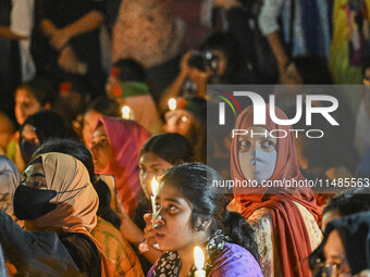 Bangladeshi women protesters are holding candlelight during the protest against rape in Dhaka, Bangladesh, on August 17, 2024. Women are mar...