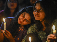 Bangladeshi women protesters are holding candlelight during the protest against rape in Dhaka, Bangladesh, on August 17, 2024. Women are mar...