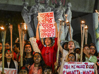 Bangladeshi women protesters are holding torches and placards during the protest against rape in Dhaka, Bangladesh, on August 17, 2024. Wome...