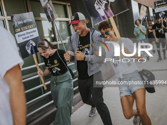 SAG-AFTRA is highlighting actors who voice Disney characters during a video game picket in Burbank, California, on August 15, 2024. (