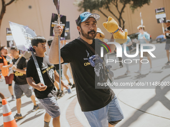 SAG-AFTRA is highlighting actors who voice Disney characters during a video game picket in Burbank, California, on August 15, 2024. (