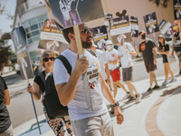 SAG-AFTRA is highlighting actors who voice Disney characters during a video game picket in Burbank, California, on August 15, 2024. (