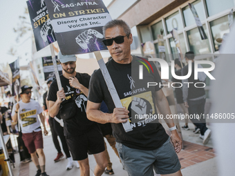 SAG-AFTRA is highlighting actors who voice Disney characters during a video game picket in Burbank, California, on August 15, 2024. (