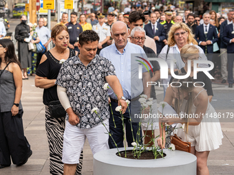 Affected families and politicians are participating in an act of tribute to the victims of the terrorist attacks that took place on August 1...