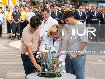 Affected families and politicians are participating in an act of tribute to the victims of the terrorist attacks that took place on August 1...