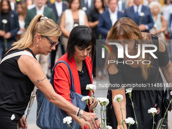 Affected families and politicians are participating in an act of tribute to the victims of the terrorist attacks that took place on August 1...