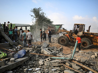 Palestinians are inspecting the site of an Israeli strike in al-Zawayda in the central Gaza Strip on August 17, 2024, amid the ongoing confl...