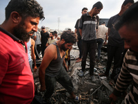 Palestinians are inspecting the site of an Israeli strike in al-Zawayda in the central Gaza Strip on August 17, 2024, amid the ongoing confl...