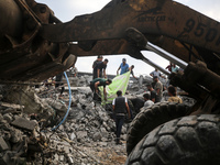 Palestinians are inspecting the site of an Israeli strike in al-Zawayda in the central Gaza Strip on August 17, 2024, amid the ongoing confl...