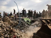 Palestinians are inspecting the site of an Israeli strike in al-Zawayda in the central Gaza Strip on August 17, 2024, amid the ongoing confl...