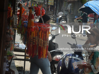 Shoppers are selling Rakhi bracelets in a shop ahead of the Raksha Bandhan festival in Siliguri, India, on August 17, 2024. The Raksha Bandh...