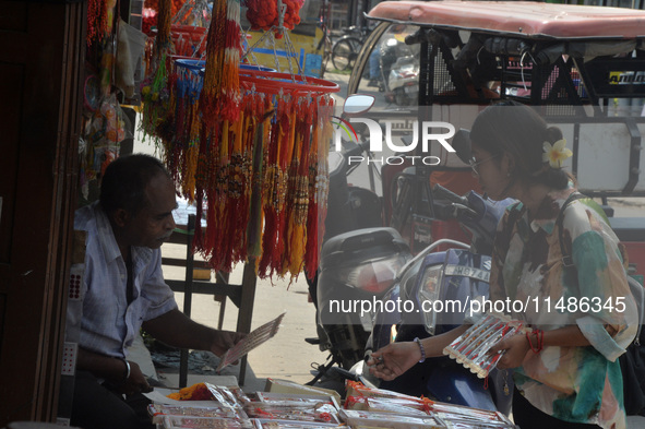 Shoppers are selling Rakhi bracelets in a shop ahead of the Raksha Bandhan festival in Siliguri, India, on August 17, 2024. The Raksha Bandh...