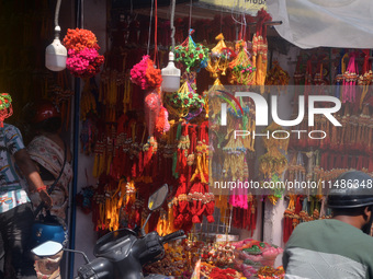 Shoppers are selling Rakhi bracelets in a shop ahead of the Raksha Bandhan festival in Siliguri, India, on August 17, 2024. The Raksha Bandh...