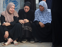 Palestinians are mourning their relatives, killed in an Israeli strike, at the Al-Aqsa Martyrs hospital in Deir el-Balah in the central Gaza...