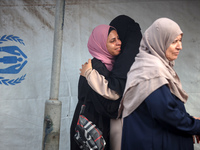 Palestinians are mourning their relatives, killed in an Israeli strike, at the Al-Aqsa Martyrs hospital in Deir el-Balah in the central Gaza...