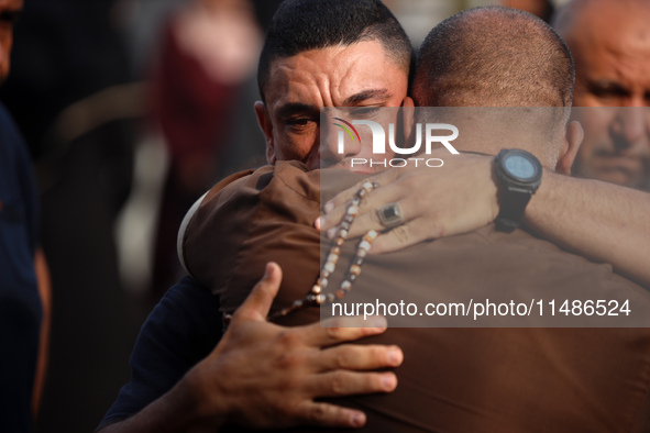 Palestinians are mourning their relatives, killed in an Israeli strike, at the Al-Aqsa Martyrs hospital in Deir el-Balah in the central Gaza...