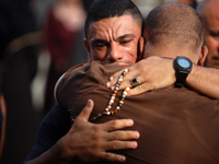 Palestinians are mourning their relatives, killed in an Israeli strike, at the Al-Aqsa Martyrs hospital in Deir el-Balah in the central Gaza...