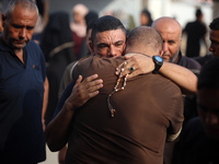 Palestinians are mourning their relatives, killed in an Israeli strike, at the Al-Aqsa Martyrs hospital in Deir el-Balah in the central Gaza...