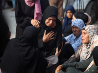 Palestinians are mourning their relatives, killed in an Israeli strike, at the Al-Aqsa Martyrs hospital in Deir el-Balah in the central Gaza...