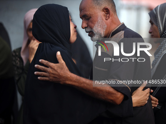 Palestinians are mourning their relatives, killed in an Israeli strike, at the Al-Aqsa Martyrs hospital in Deir el-Balah in the central Gaza...