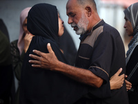 Palestinians are mourning their relatives, killed in an Israeli strike, at the Al-Aqsa Martyrs hospital in Deir el-Balah in the central Gaza...