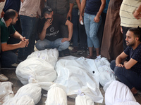 Palestinians are mourning their relatives, killed in an Israeli strike, at the Al-Aqsa Martyrs hospital in Deir el-Balah in the central Gaza...