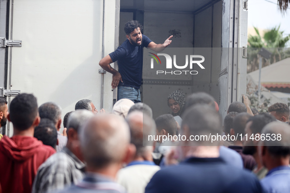 Palestinians are mourning their relatives, killed in an Israeli strike, at the Al-Aqsa Martyrs hospital in Deir el-Balah in the central Gaza...